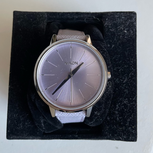 Nixon women’s Kensington watch with a lavender leather band. Brand new with box.